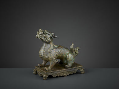A BRONZE FIGURE OF A QILIN, QIANLONG SIX-CHARACTER MARK AND OF THE PERIOD (1736-1795)