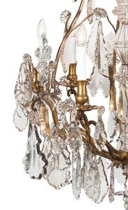 A 19th Century French Louis XV Style Crystal And Gilt Twelve-Light Chandelier