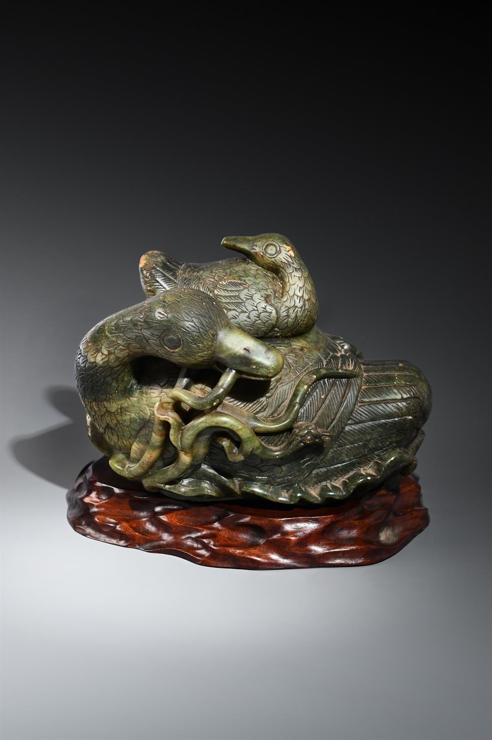 A Large Chinese Spinach Jade 'boulder' carving of a 'duck', Qing Dynasty