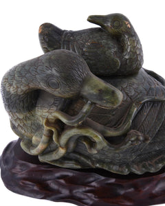 A Large Chinese Spinach Jade 'boulder' carving of a 'duck', Qing Dynasty