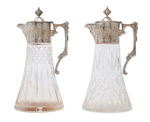 A MATCHED PAIR OF SILVER PLATE-MOUNTED CUT CRYSTAL CLARET JUGS