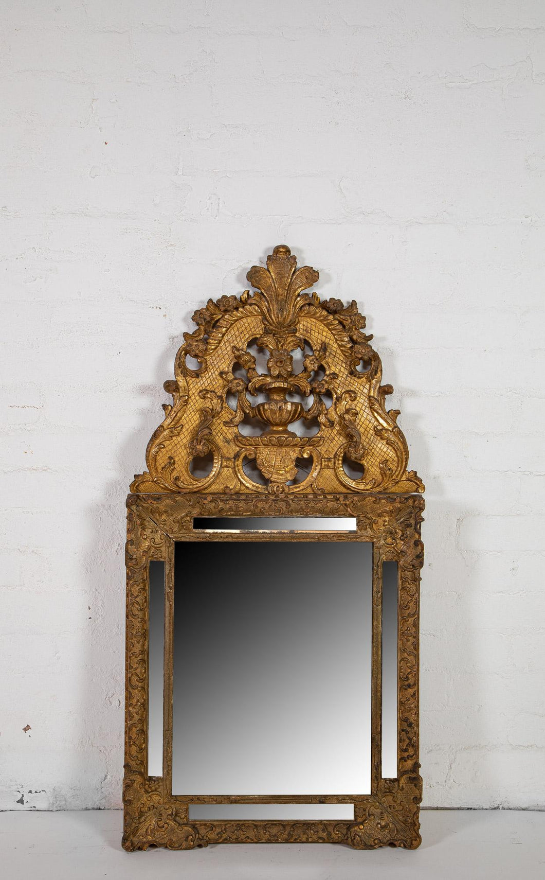 A Giltwood and Gesso Louis XV Wall Mirror, French First Half of the 18th Century