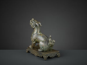 A BRONZE FIGURE OF A QILIN, QIANLONG SIX-CHARACTER MARK AND OF THE PERIOD (1736-1795)