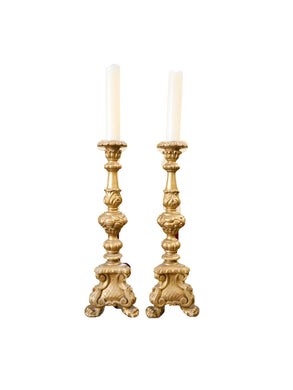 A PAIR OF ANTIQUE STYLE ITALIAN CARVED AND GILT PRICKET CANDLESTICKS