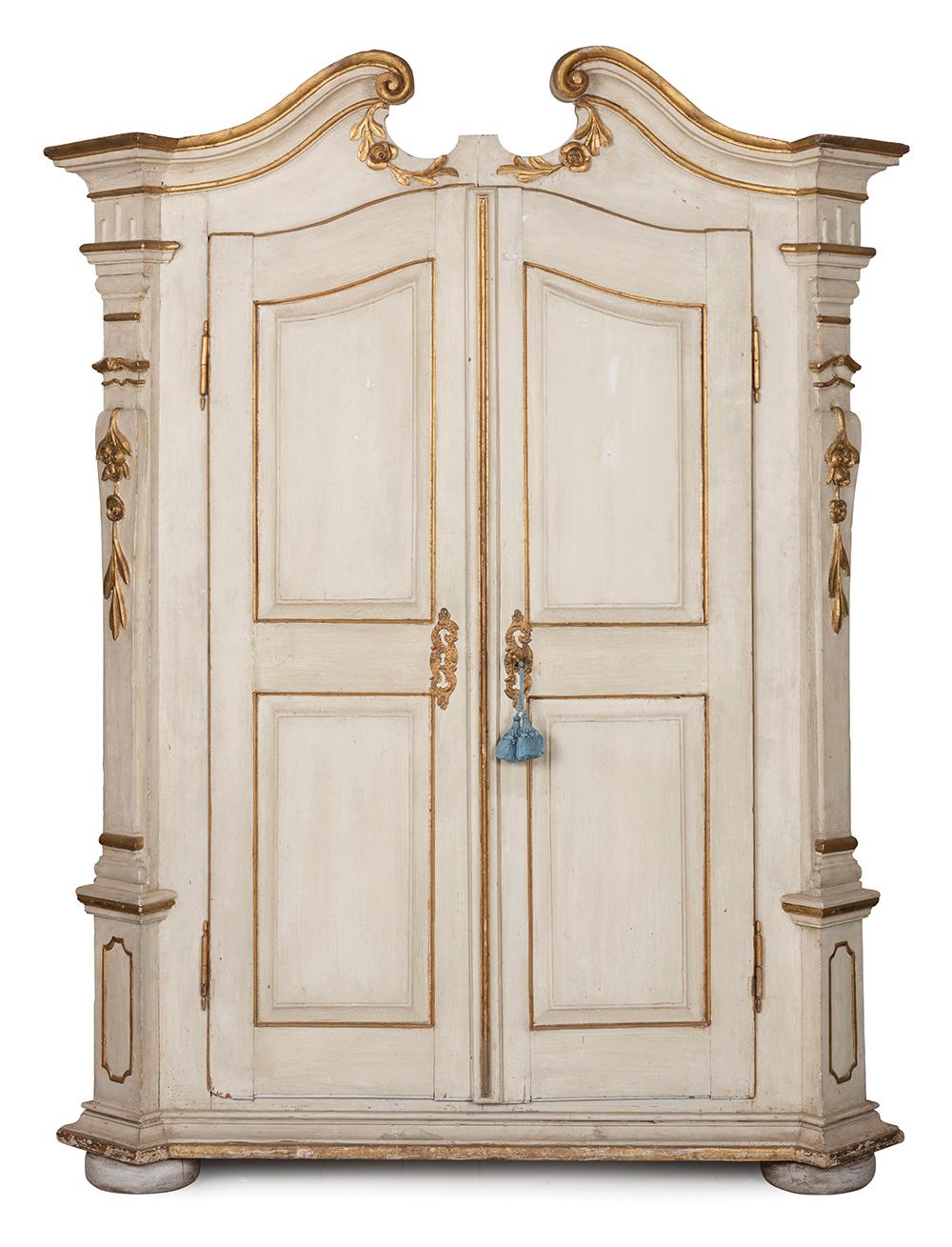 AN IMPRESSIVE ITALIAN WHITE AND GILT PAINTED CUPBOARD, PROBABLY TUSCAN 18TH CENTURY