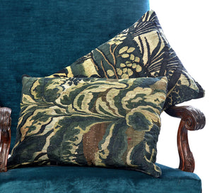 A PAIR OF CUSHIONS FASHIONED FROM TWO FRAGMENTS OF 17TH CENTURY VERDURE TAPESTRY
